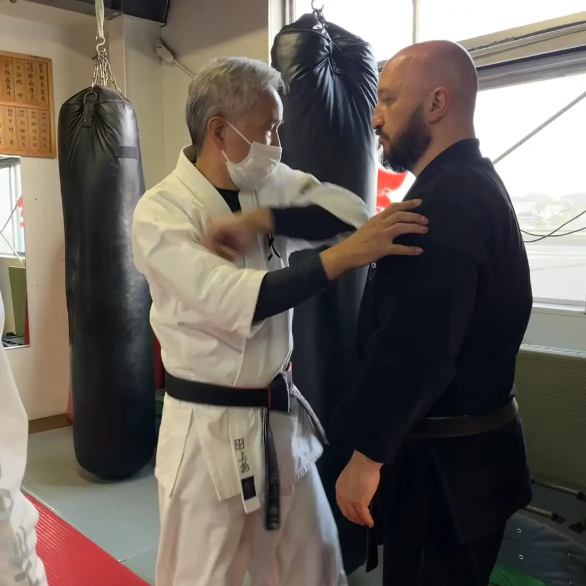 Olgun Tiltay learning mawashi empi round elbow strike from Nobuya Tagami Sensei [9th Dan Tomarite Karate] in Ise Japan